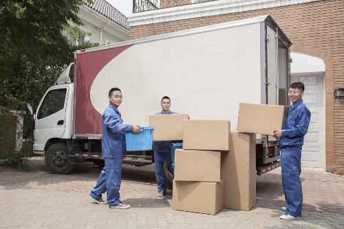 Same day removals team loading furniture in Ilford street