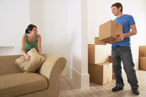 Professional movers loading items for transport in Ilford